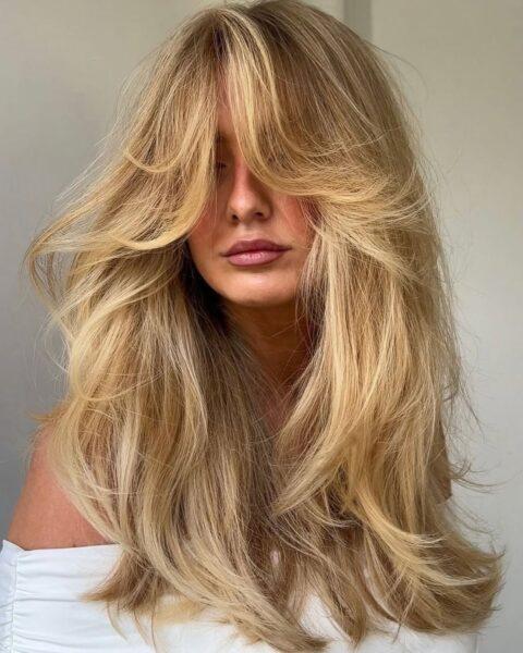 70s inspired long layers curtain bangs
