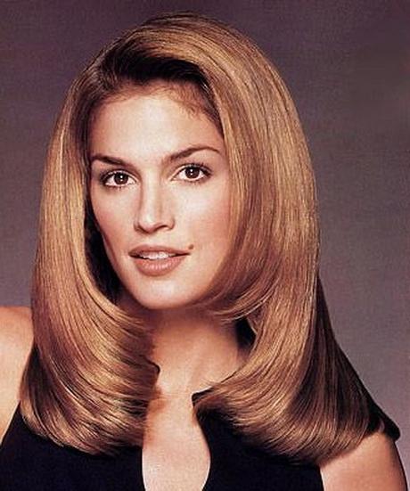 Warm brunette hair with classic 90s blowout volume