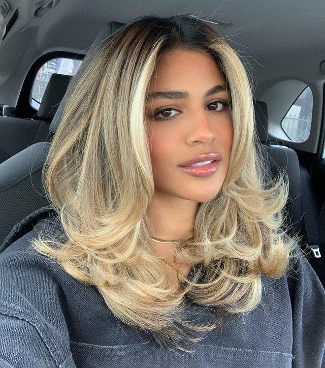 Cool blonde layered 90s blowout hair look