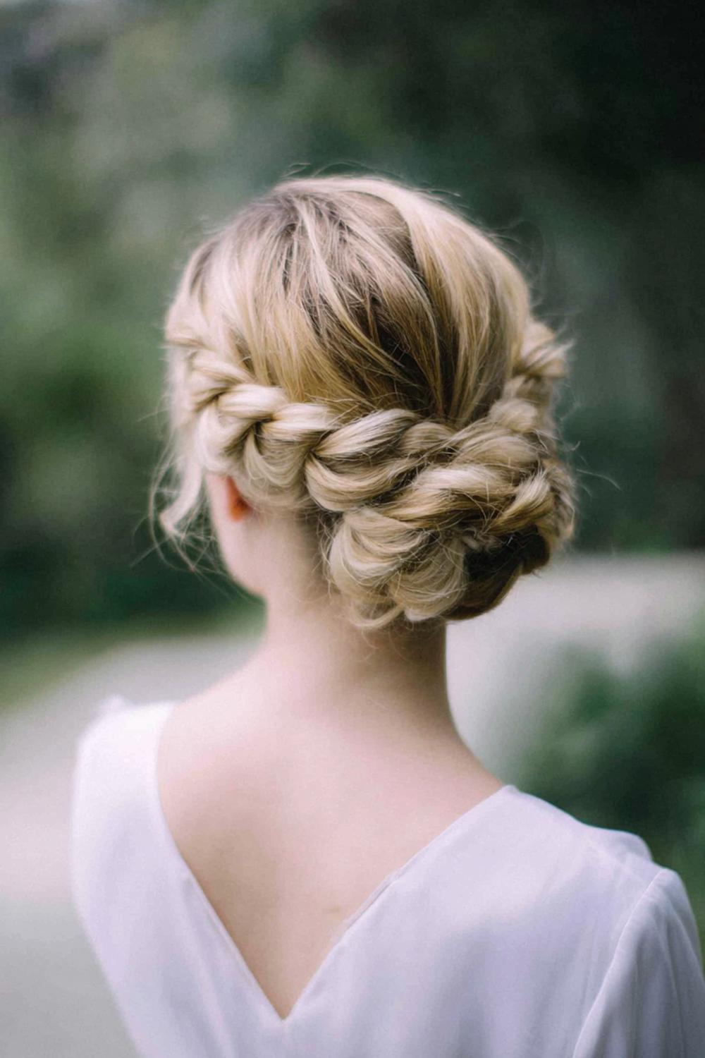 22. Best Hairstyles for 2026: Updo Hairstyle with Braided Crown and Low Chignon