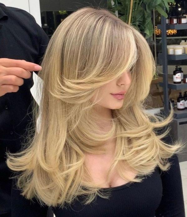 Blonde blowout layers curtain bangs