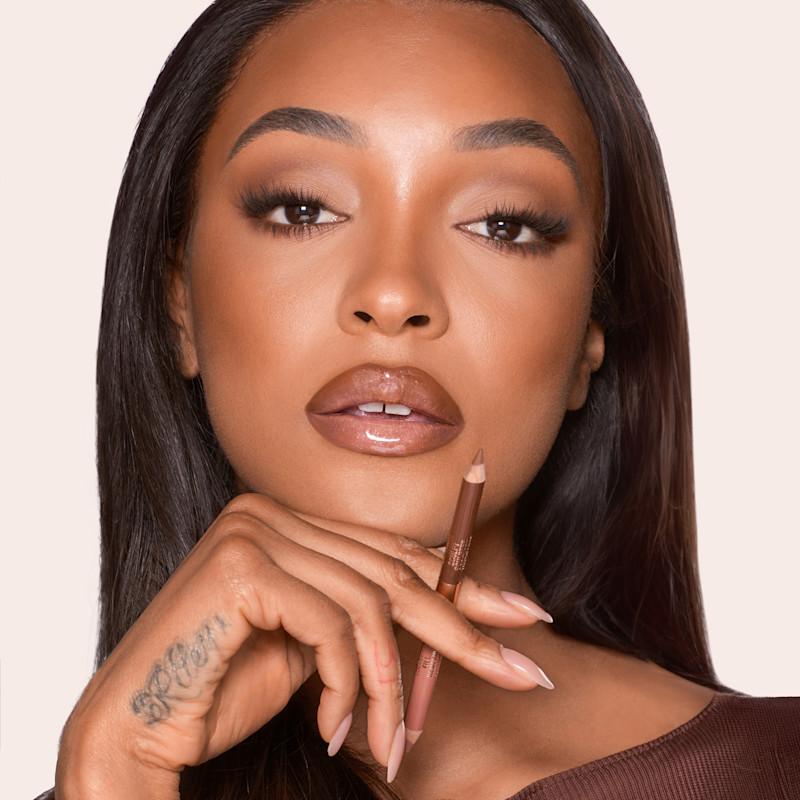 Brown liner and glossy nude lips