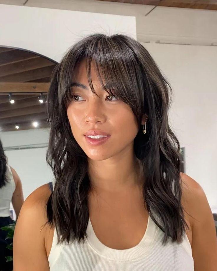 Brunette wispy curtain bangs look