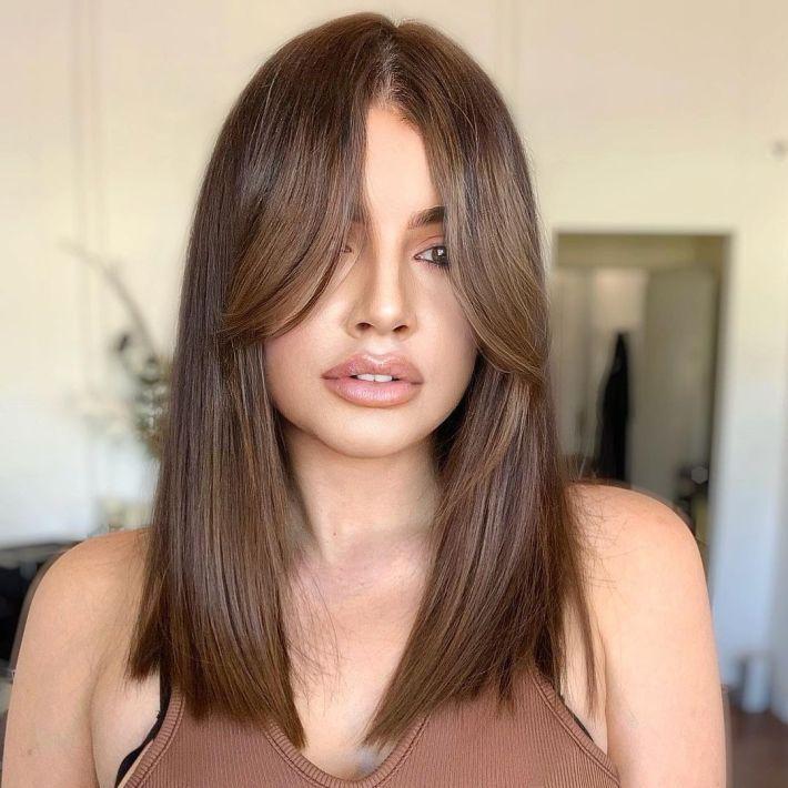 Brushed out curtain bangs straight hair