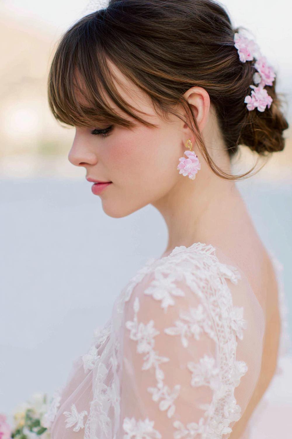 27. Bridal-Ready Celebrity Inspired Hairstyles 2026 Soft Updo with Floral Accents