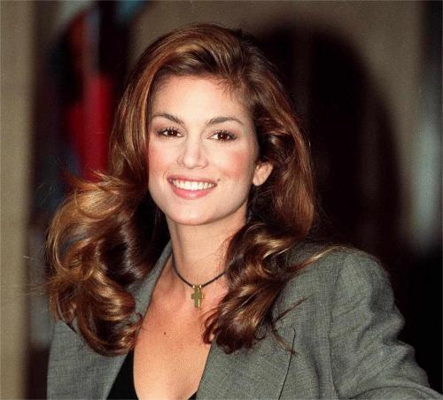 Brunette woman showing polished 90s blowout hair style