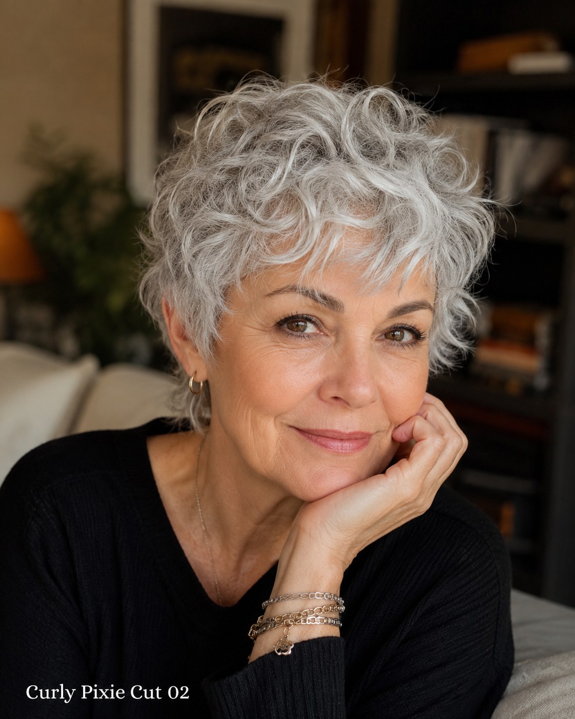 Silver curly pixie cut with soft rounded volume suited to naturally gray, loosened curls