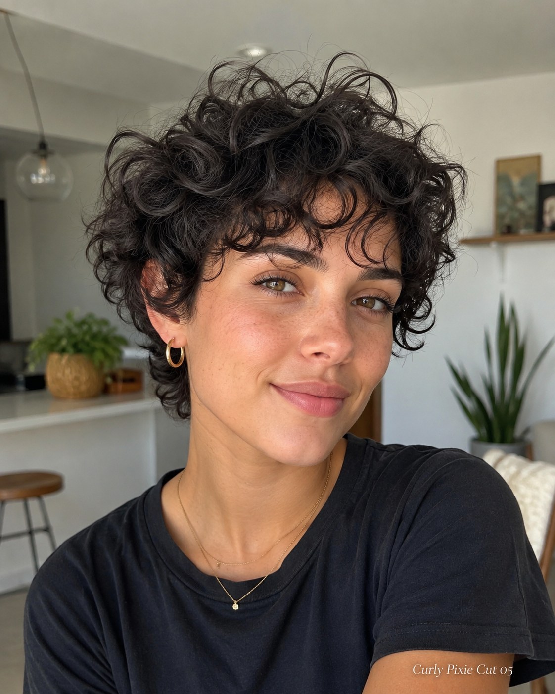 Shaggy undone curly pixie cut with loose textured layers for a low-maintenance look