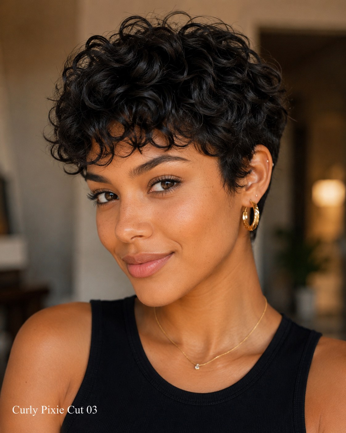 Voluminous curly pixie cut with tight defined ringlets building height at the crown