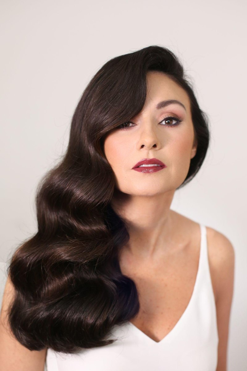 Deep side part dark Hollywood waves
