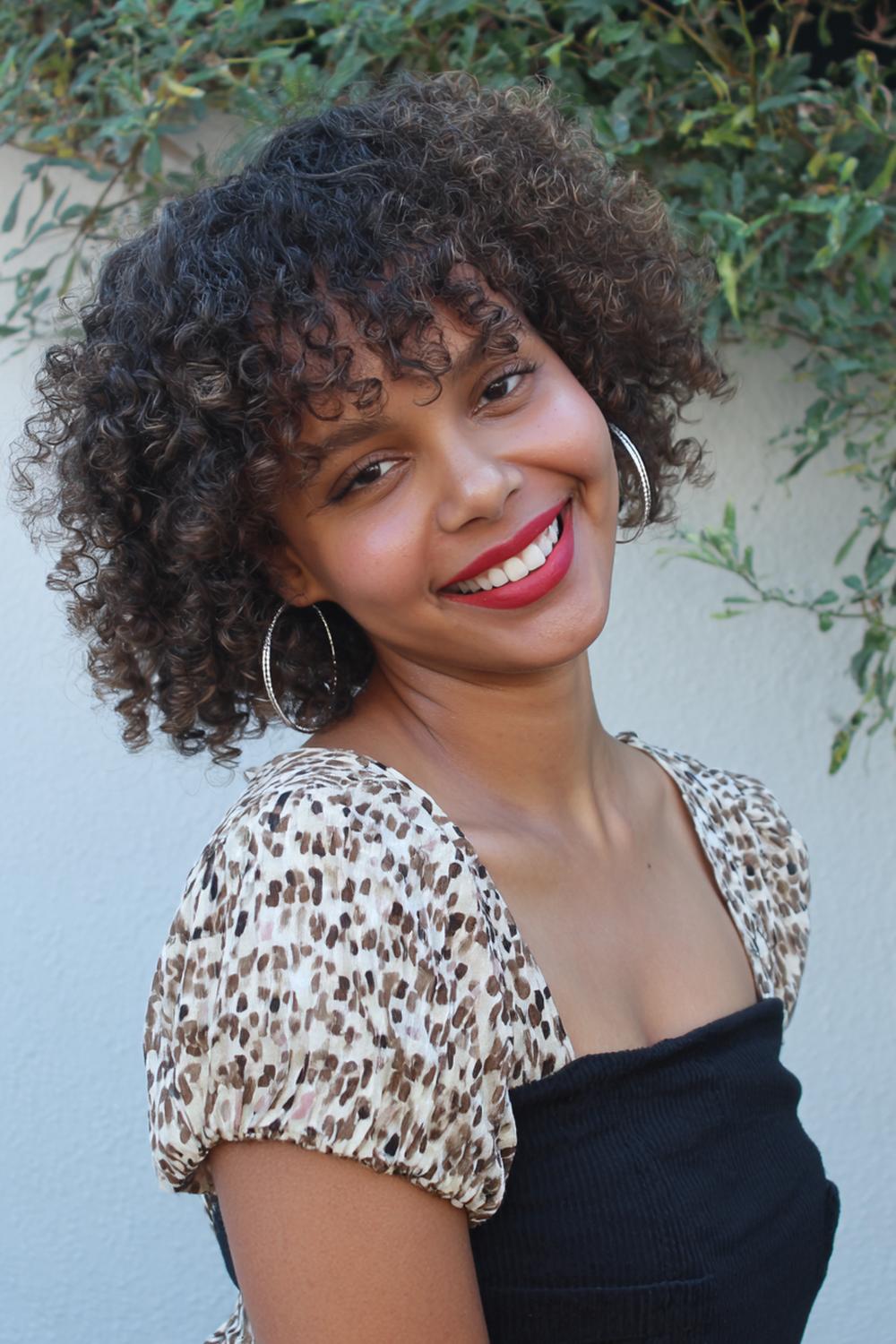 16. Curly Refresh Hairstyle with Water Mist and Defined Front Pieces