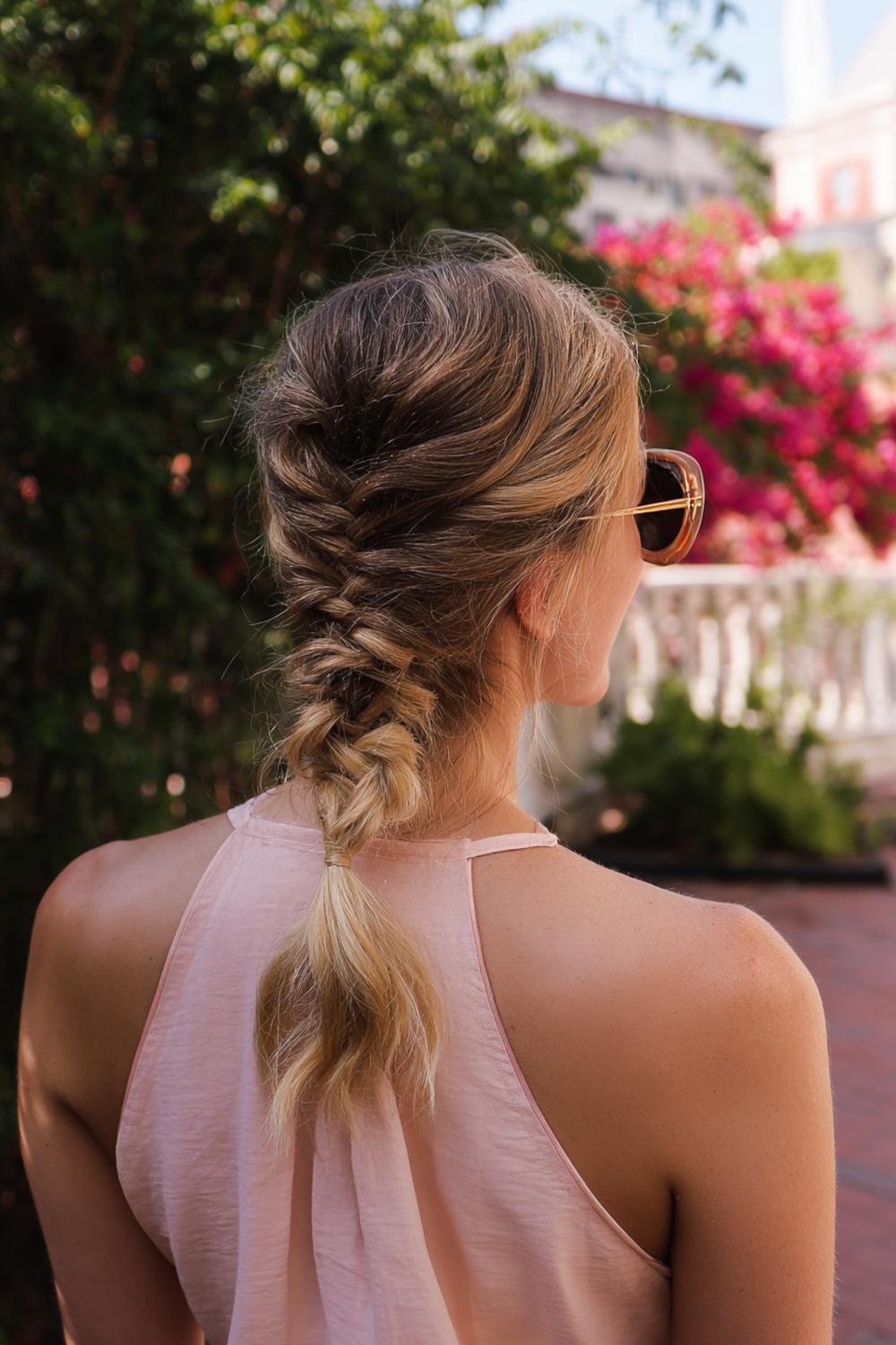 25. Low Ponytail Braid Hairstyle with Rope Twist and Minimal Flyaways