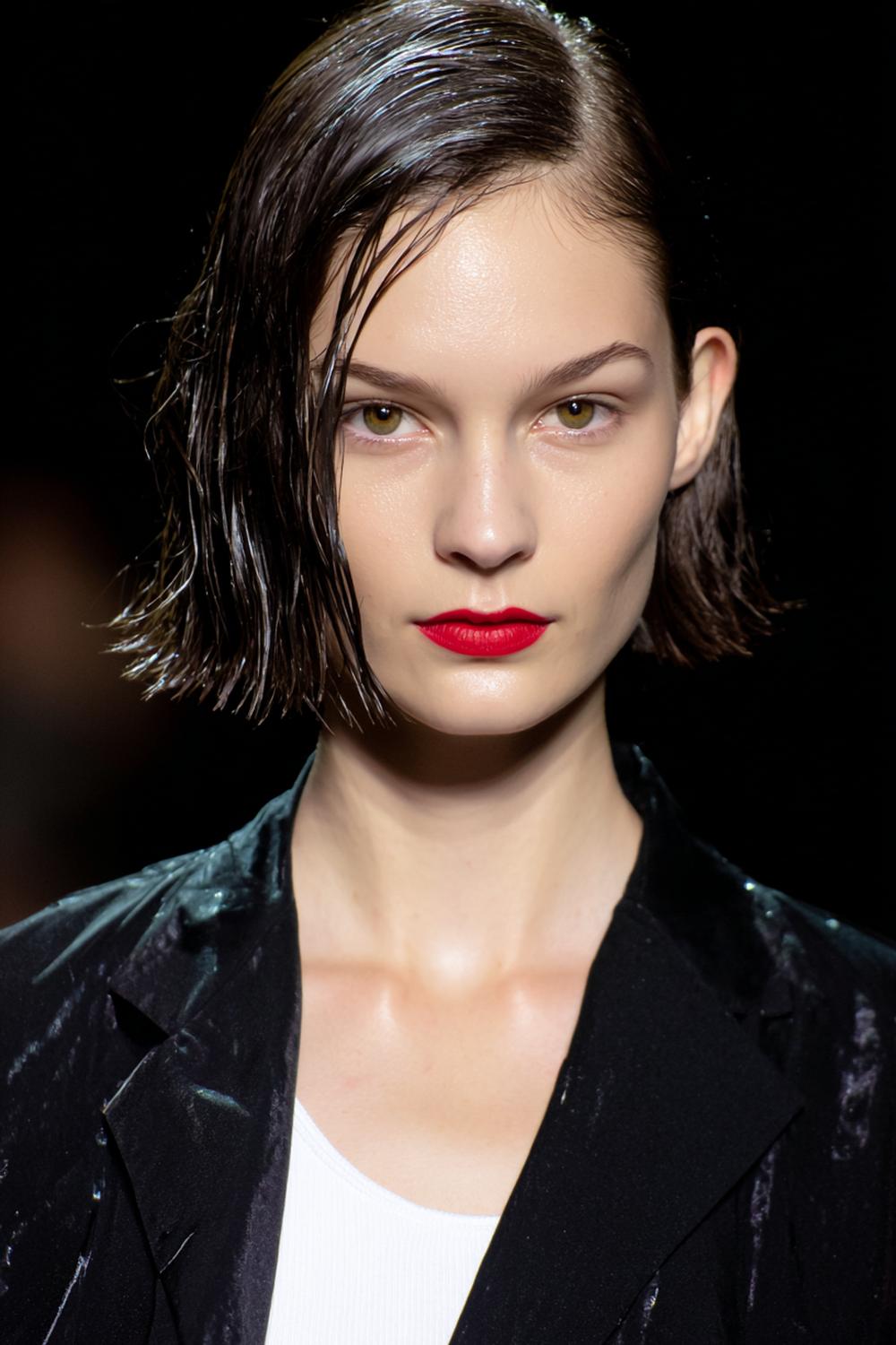 25. Everyday Hairstyles for Women: Sleek Wet-Look Bob with Sharp Side Part