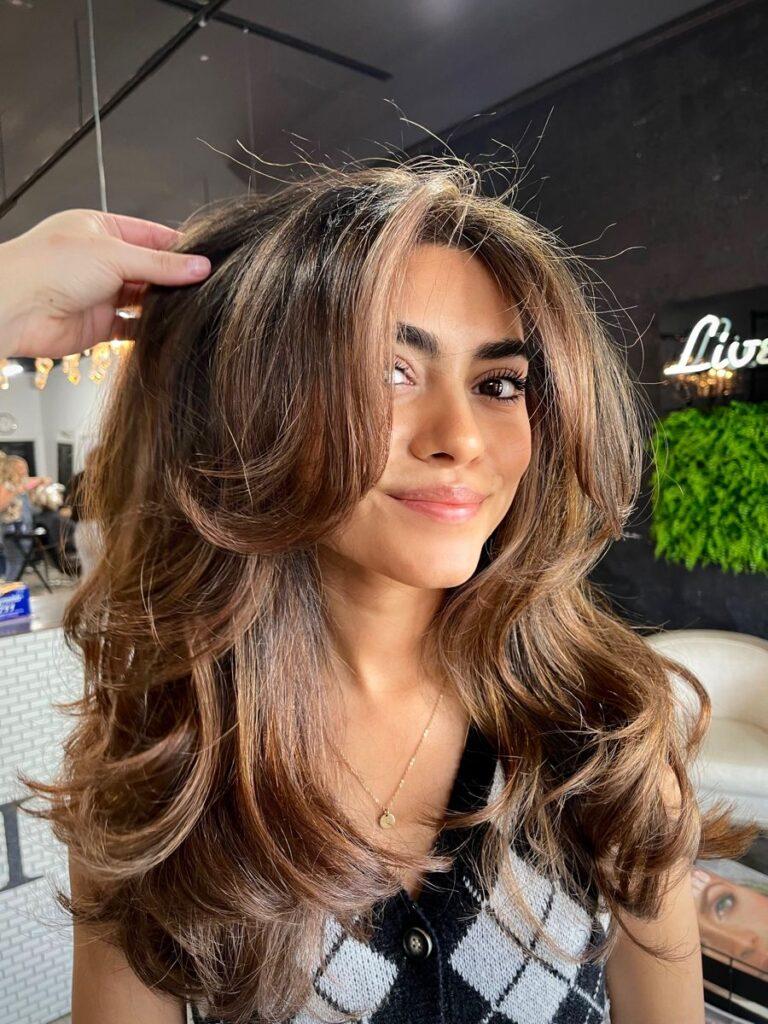 Blowout curtain bangs hairstyle