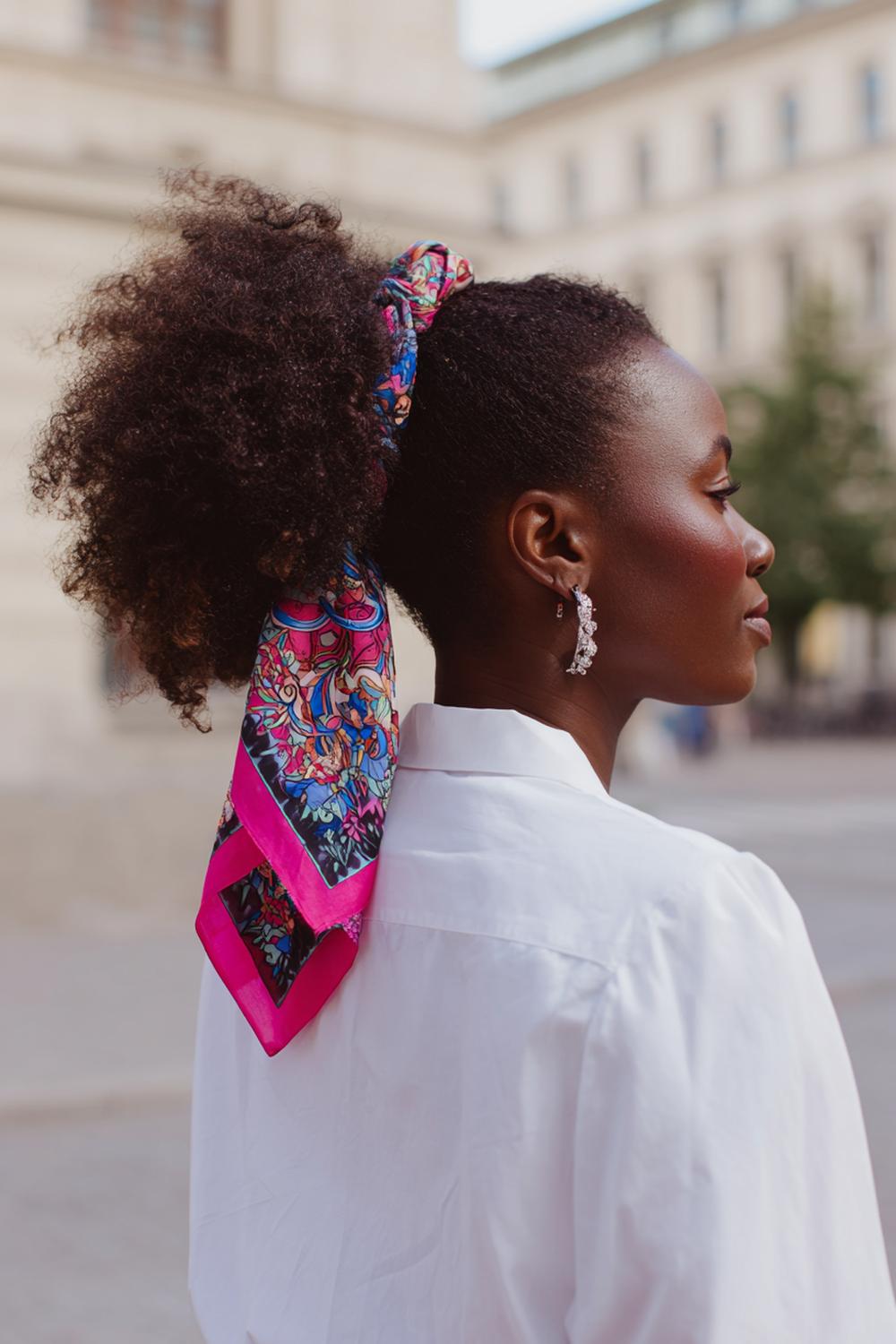 21. Scarf-Wrapped Ponytail Hairstyle with Printed Fabric and Movement