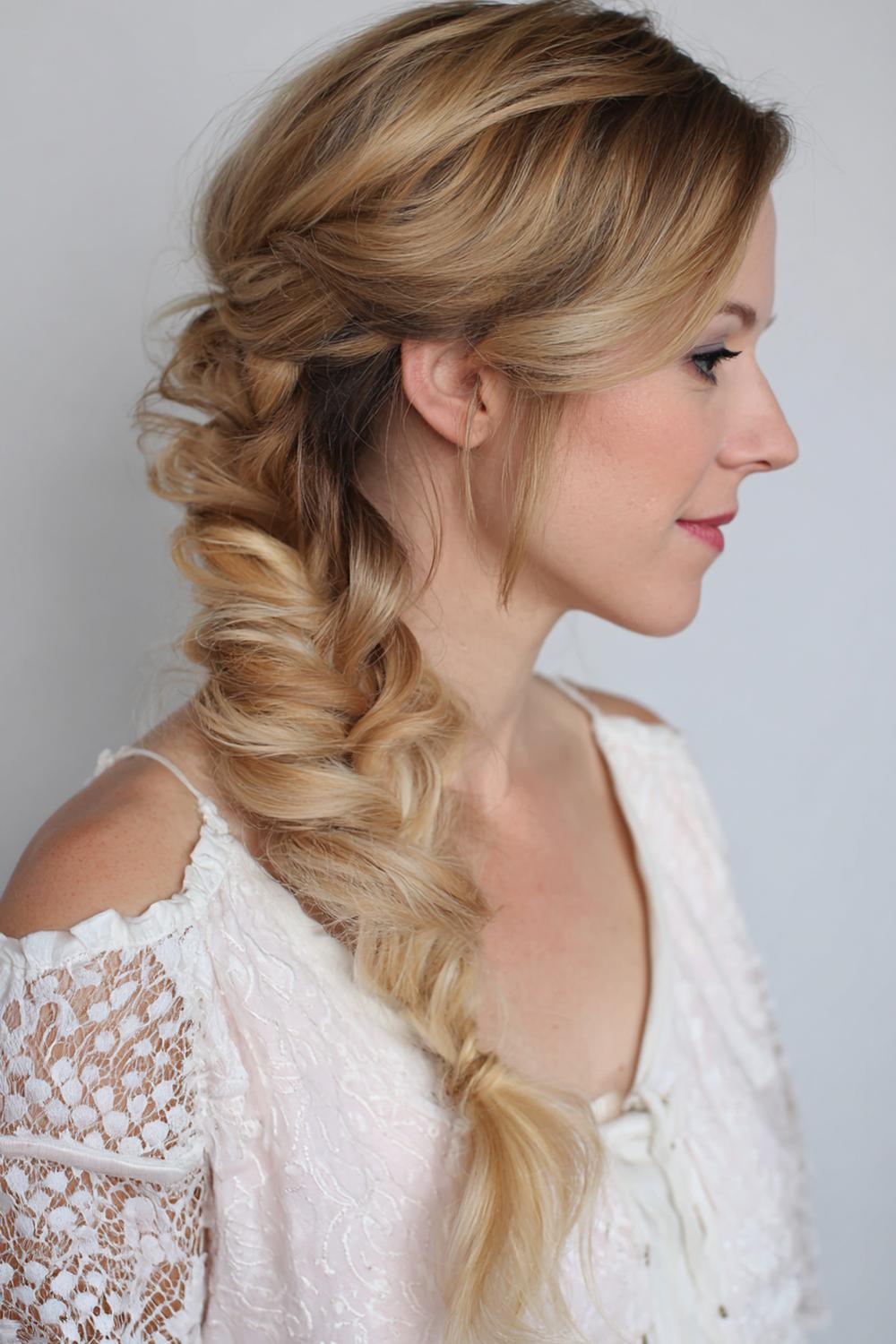 6. Messy Side Braid Hairstyle with Pulled Loops and Soft Texture