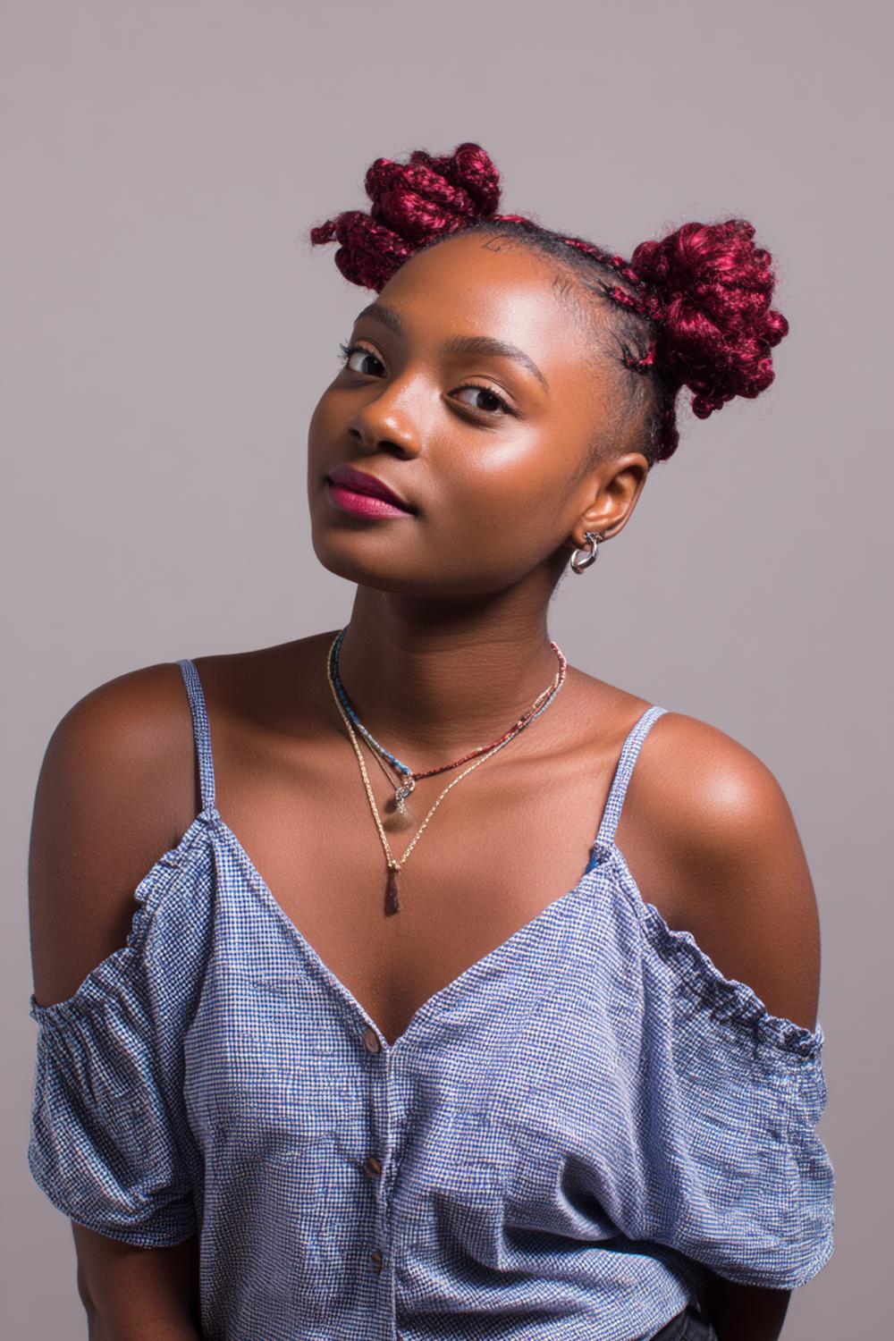 9. Hairstyles for All Hair Types: Space Buns with Clean Parts and Defined Edges