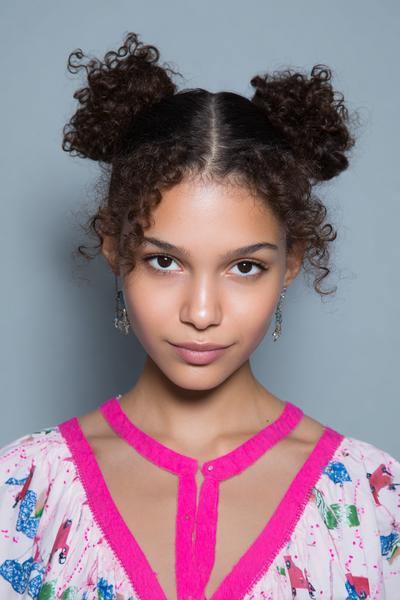 17. Two Low Curly Buns with Clean Middle Part for hairstyles for curly hair for school ideas