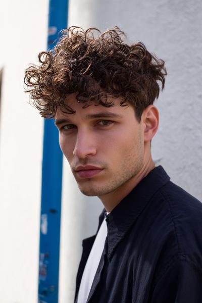 5. Curly Crop with Textured Fringe for hairstyles for curly hair men ideas