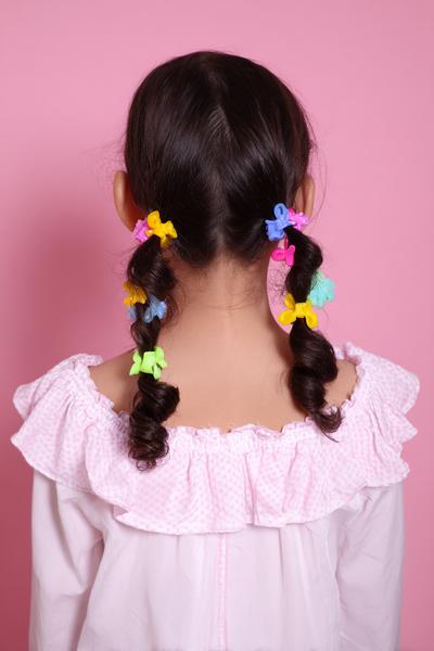 7. Double Bubble Ponytails with Bright Clips for hairstyles for curly hair kids ideas