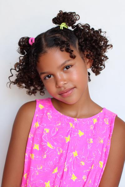 23. Curly Space Buns with Face-Framing Tendrils for hairstyles for kids curly hair ideas