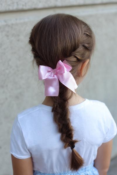 8. Fishtail Side Braid with Satin Bow for hairstyles for kids braids ideas