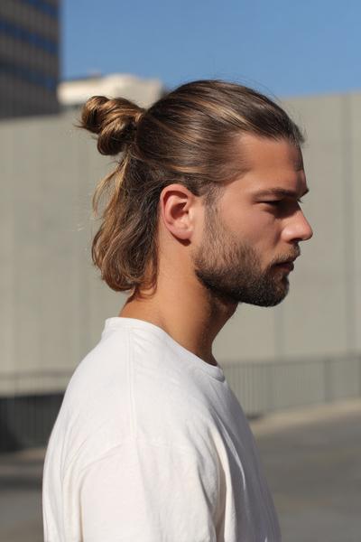 13. Shoulder-Length Tucked Man Bun with Clean Fade for hairstyles for long hair men ideas