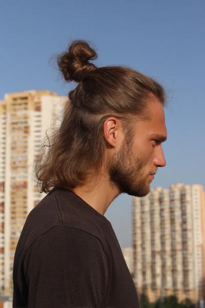 14. Half-Up Top Knot with Natural Texture for hairstyles for long hair men ideas