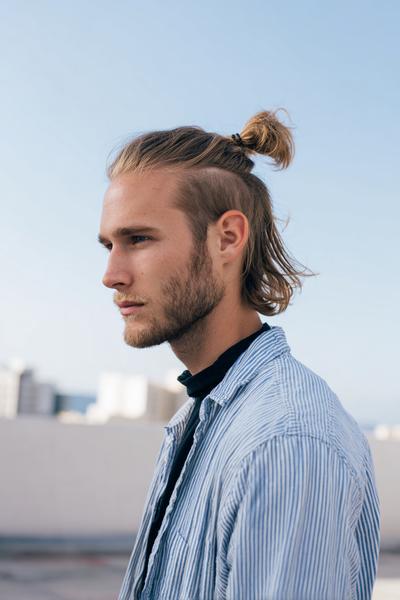 18. Half-Up Man Bun with Clean Undercut Line for hairstyles for medium length hair men ideas
