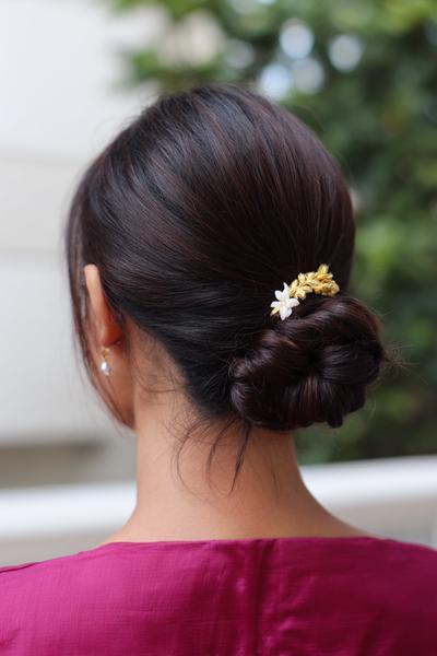 25. Juda-Inspired Low Bun with Jasmine Accent for hairstyles for medium length hair indian ideas