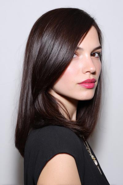 4. Sleek Side Part and Tucked Ends for hairstyles for medium length hair easy ideas