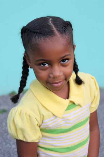 26. Four Cornrow Braids into Low Puffs for little black girls simple school hairstyles braids ideas