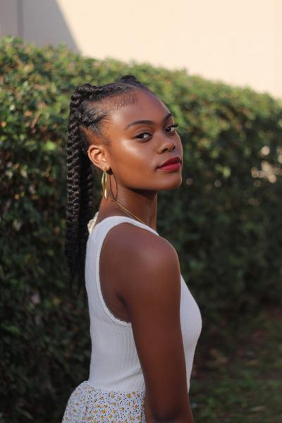 8. Low Braided Ponytail with Sleek Middle Part for hairstyles for school braids black teens ideas