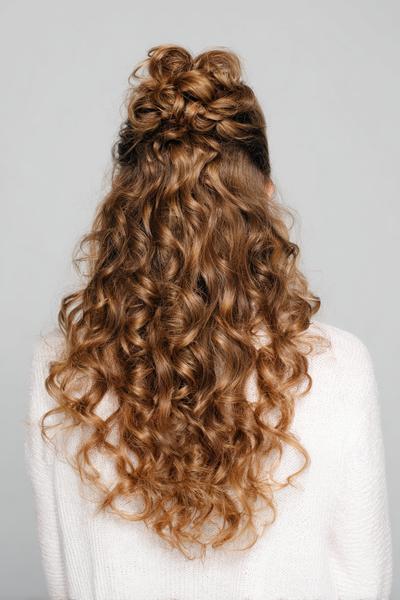 27. Half-Up Bun for Hairstyles for School Curly Hair Bun with a Curly Waterfall Back