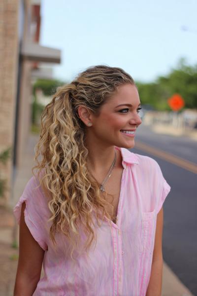 22. Low Curly Ponytail Hairstyles for School Easy Curly Hair With Twisted Sides