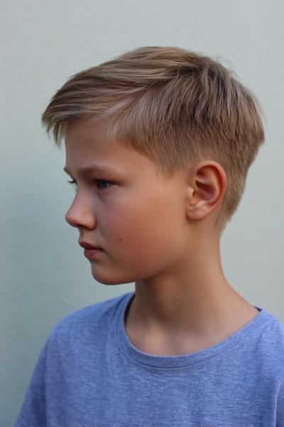 18. Clean Taper Cut With Side Part for hairstyles for school kids boys ideas