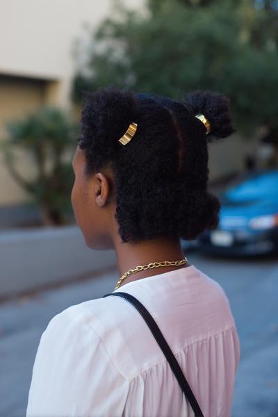 4. Twisted Half-Up Mini Buns With Gold Cuffs for hairstyles for school kids black ideas