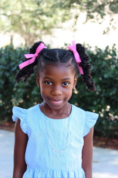 5. Defined Twist-Out Pigtails With Ribbon Ties for hairstyles for school kids natural hair ideas