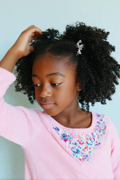 8. Wash-and-Go Curls With Clip-In Accent for hairstyles for school kids natural hair ideas