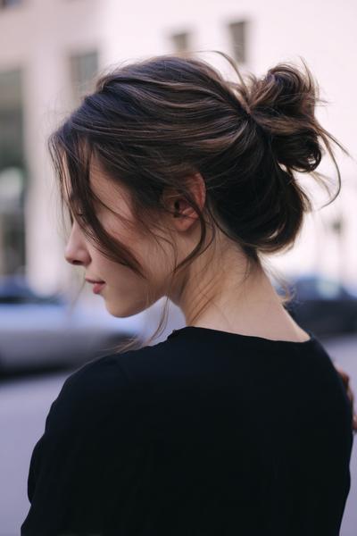 24. Messy Low Bun for Hairstyles for School Up Bun With Loose Pieces and Soft Volume