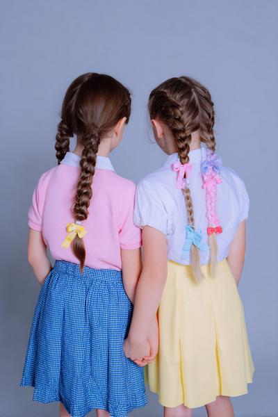 8. Two Low Pigtail Braids for Hairstyles for School Kids with Color Clips