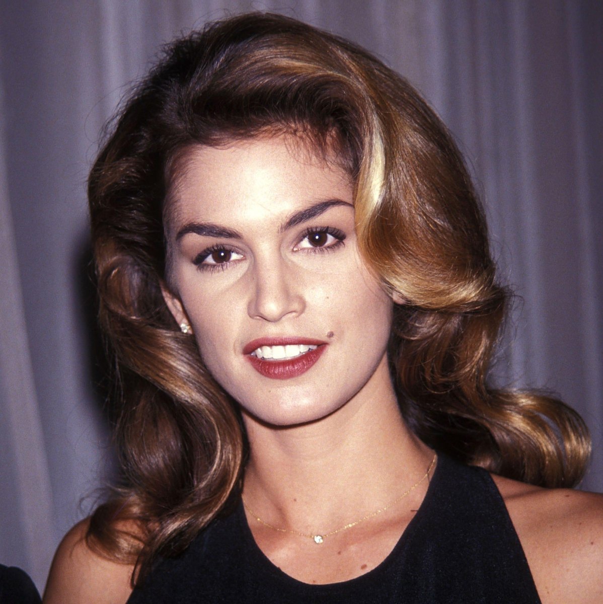 Sleek layered blonde 90s blowout hair finish