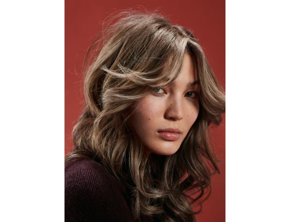 70s inspired layered curtain bangs