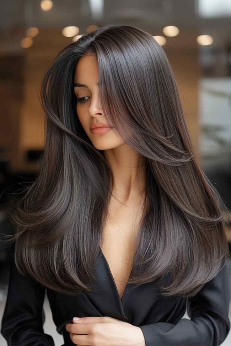 Glossy blowout with curtain bangs
