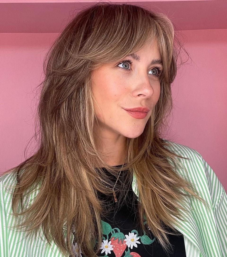 Choppy textured curtain bangs
