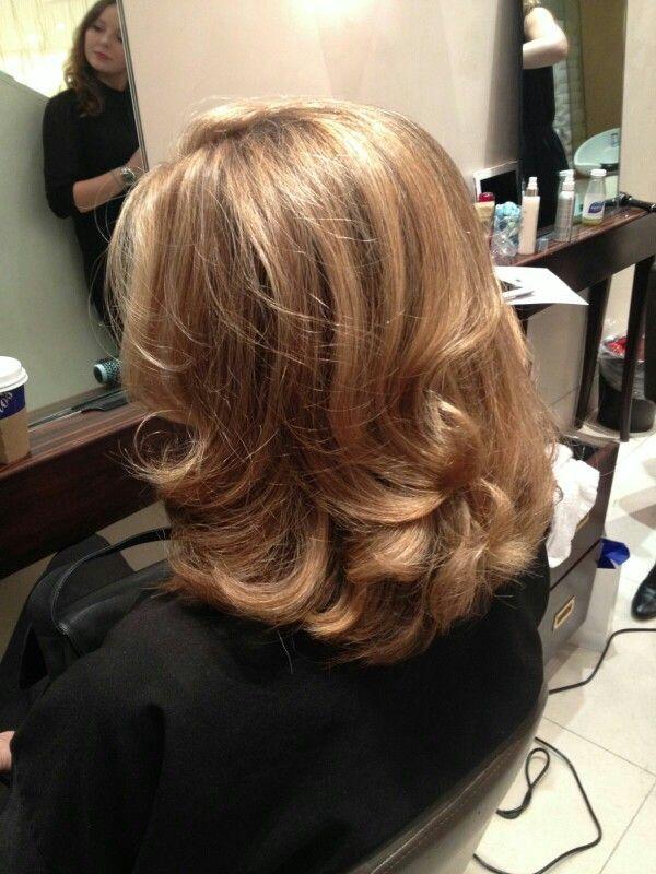 Medium length layered blowout style