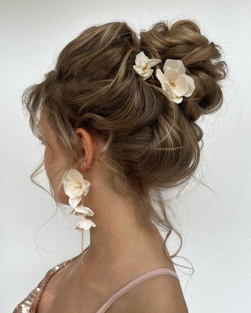 Floral messy prom updo