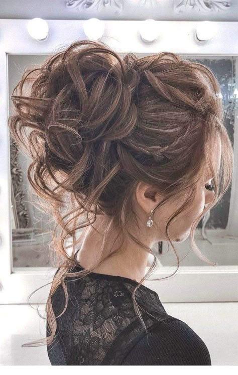 Bridal inspired messy high bun updo with texture