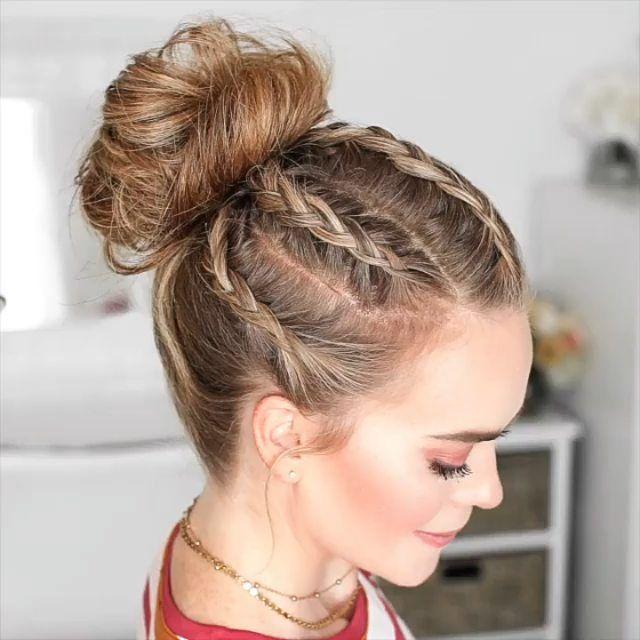 Pearl accented messy high bun updo hairstyle