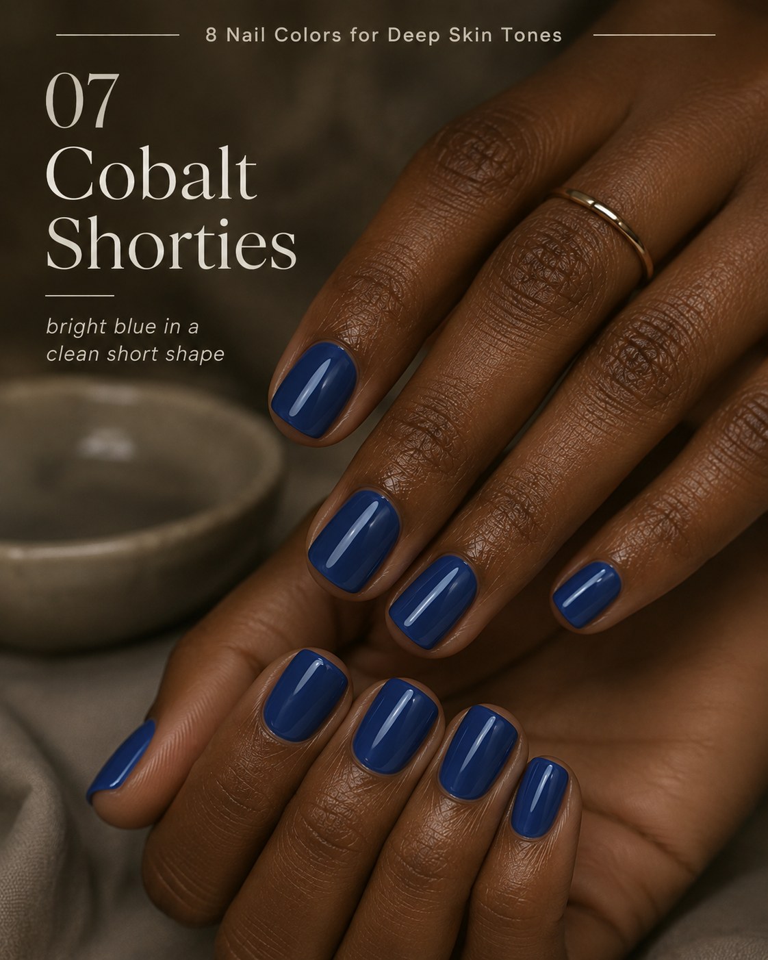 Bright cobalt blue nail color for deep skin tones in a clean short squoval shape